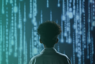 Image of a child staring at digital lines of code